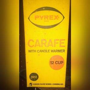 Vintage retro Pyrex carafe with candle warmer.